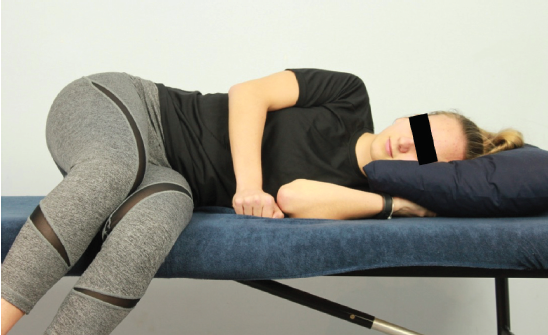 Static opener demonstration: side-lying, hip and knee flexion, opening the intervertebral foramen to decompress the nerve and allow blood flow